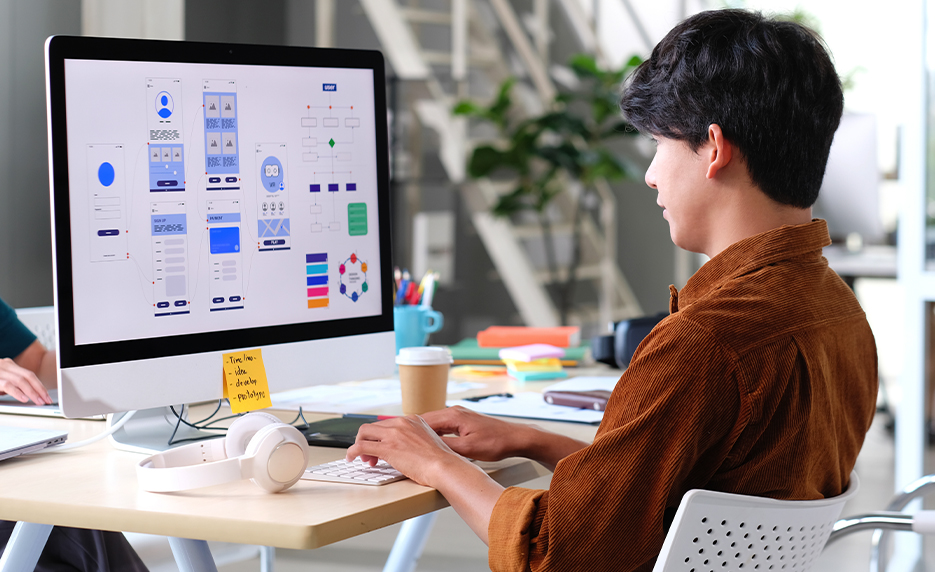 Jessica working on a laptop